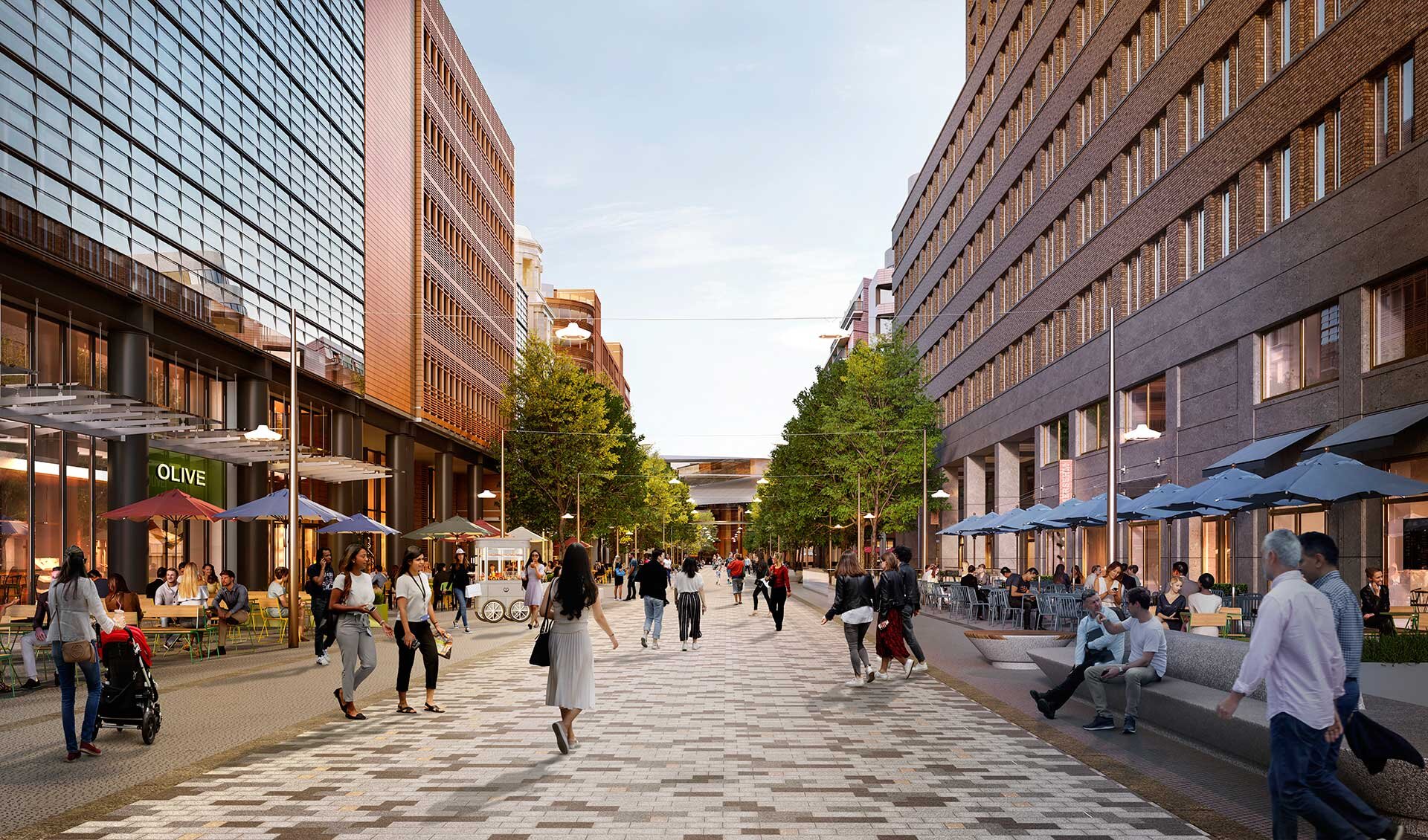 Project by Behnisch Architekturbuero, Potsdamer Platz Quartier. A bustling pedestrian zone with people, seating, trees and shops between multi-story buildings.