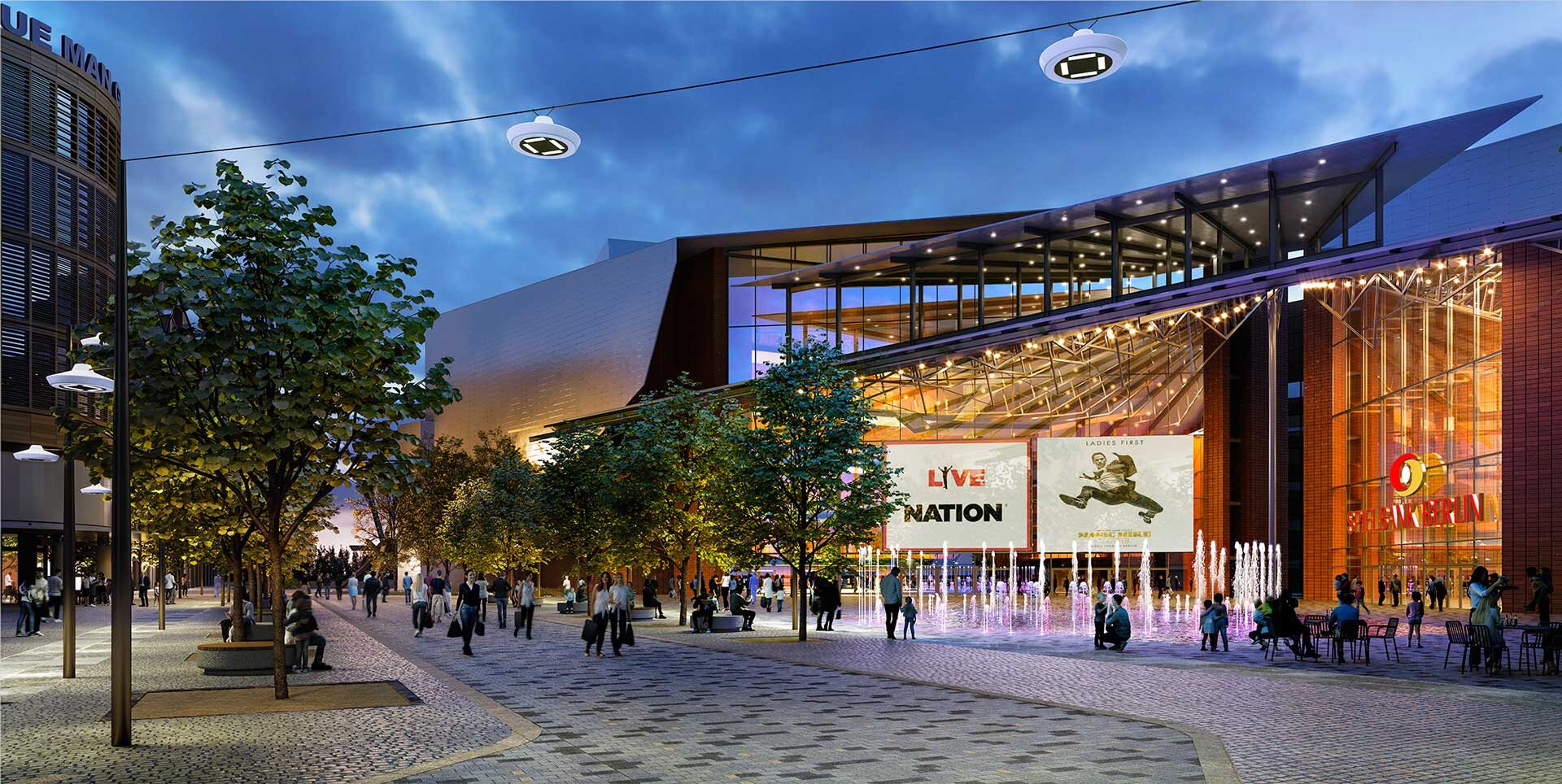 Project by Behnisch Architekturbuero, Potsdamer Platz Quartier. Evening atmosphere in a public square with people, trees, fountains and an illuminated glass facade with large signs.