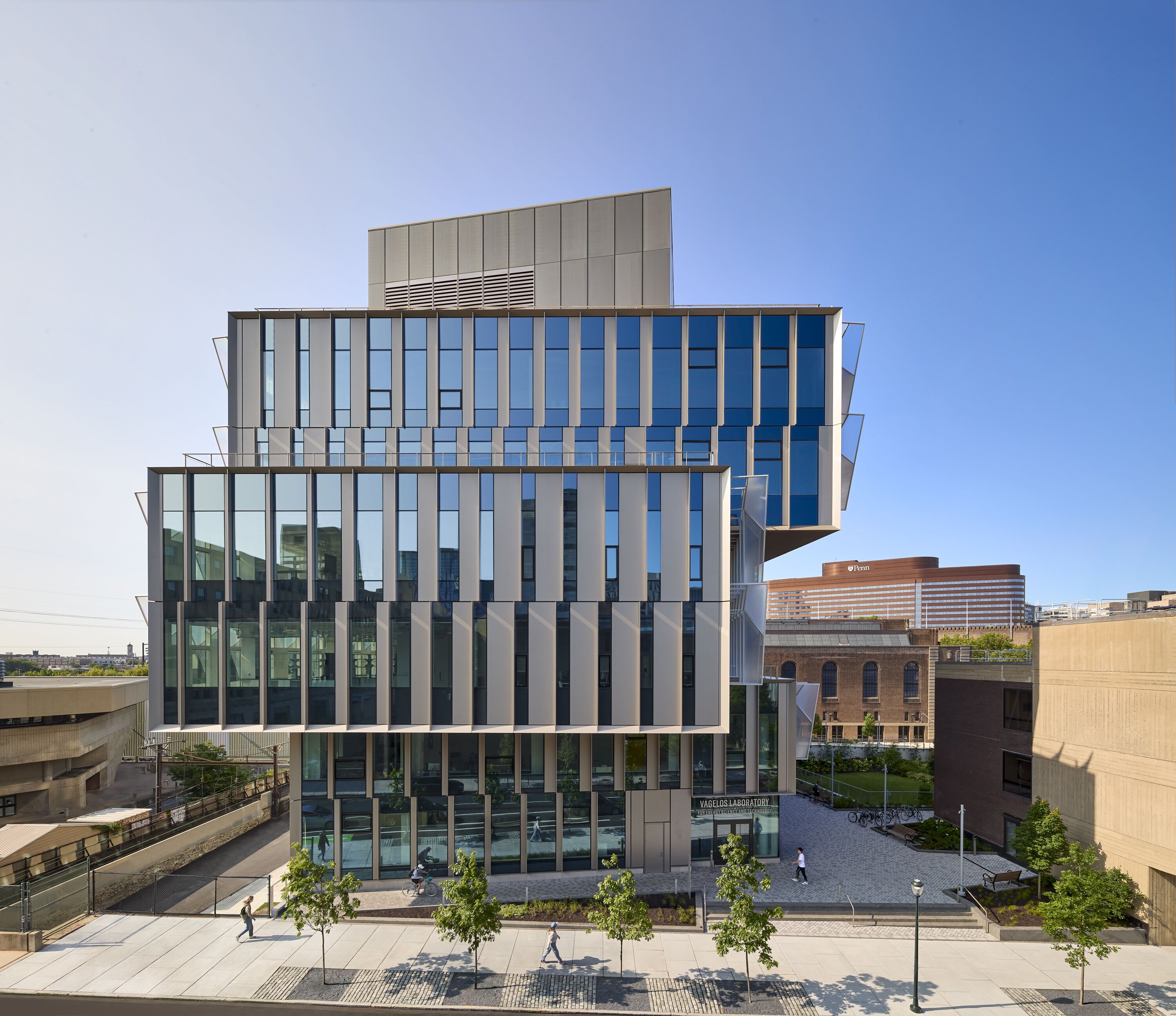 Project by Behnisch Architekturbuero, The Vagelos Laboratory for Energy Science & Technology, University of Pennsylvania. Modern glass building with vertical fins and stacked volumes in urban setting.