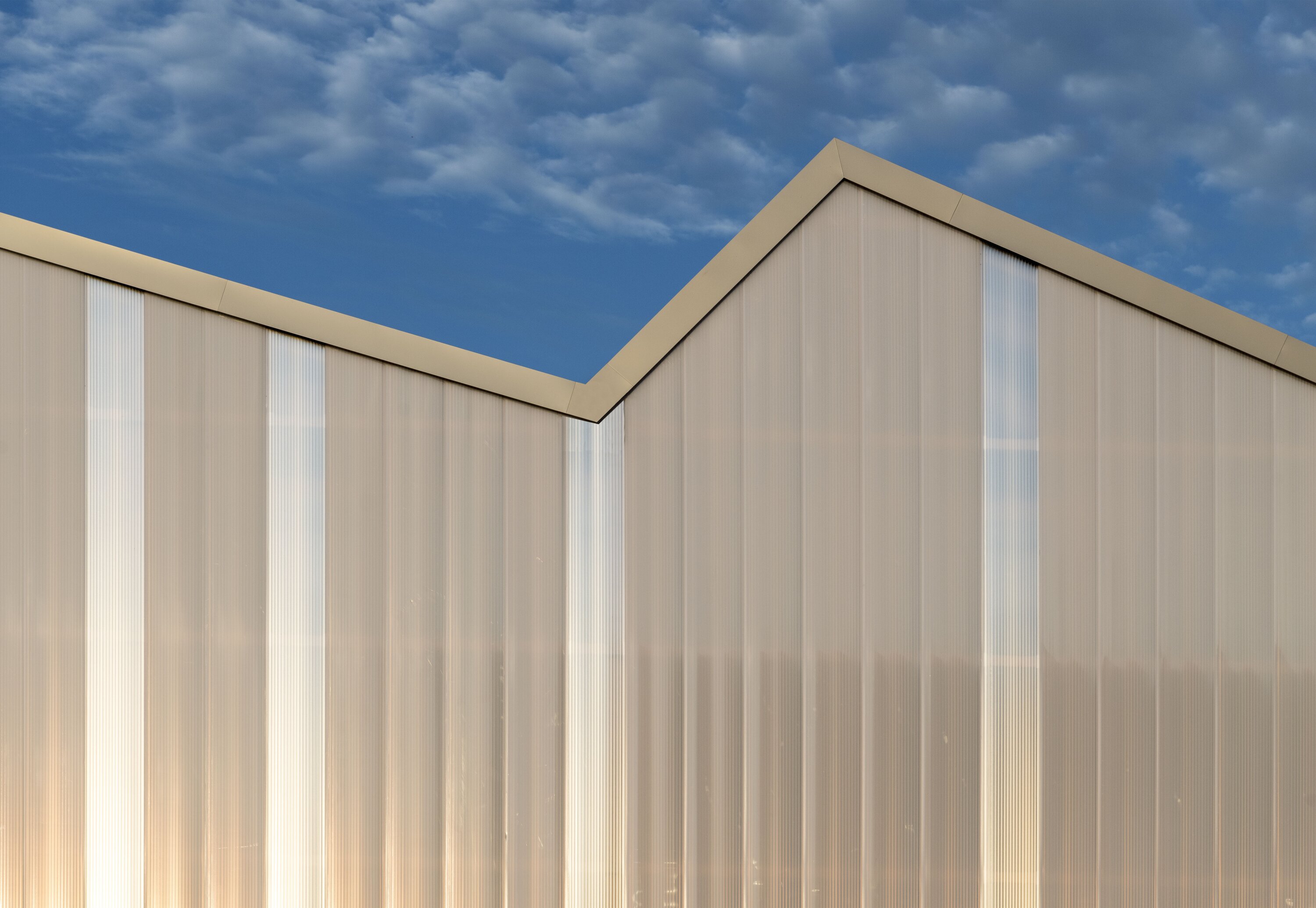 Project by Behnisch Architekturbuero, KIT Energy Lab 2.0. Close-up of the sloping roof shapes.