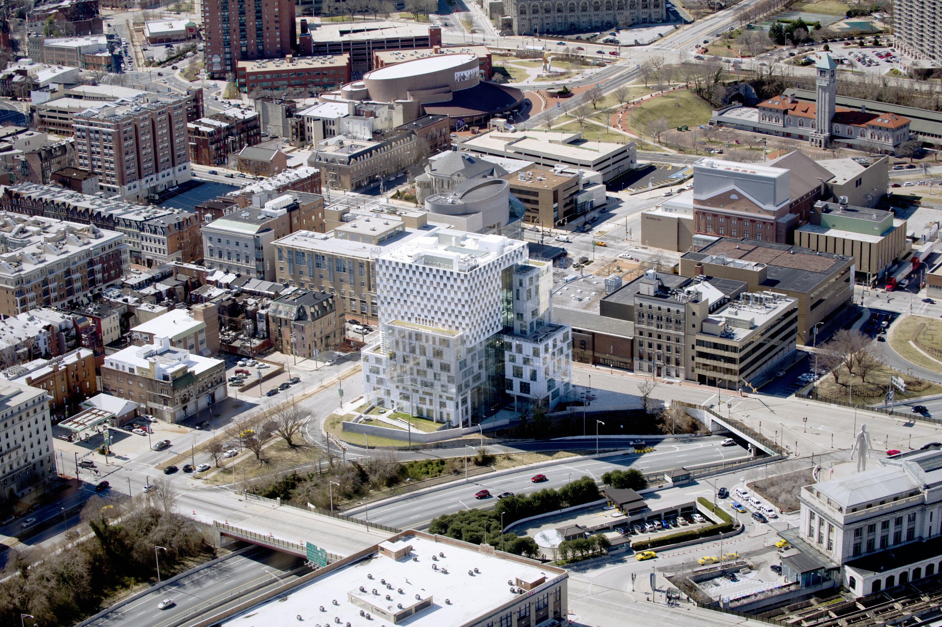 Project by Behnisch Architekturbuero, The John and Frances Angelos Law Center. Aerial view of the building in the context of the surrounding cityscape.